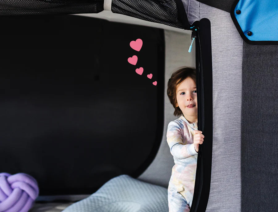 Child resting safely inside a Cubby Bed
