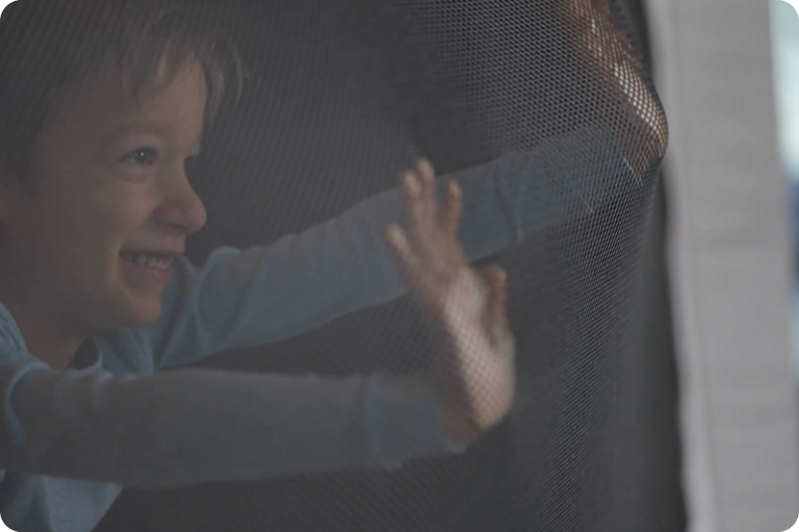 Child pressing against the tensioned canopy wall